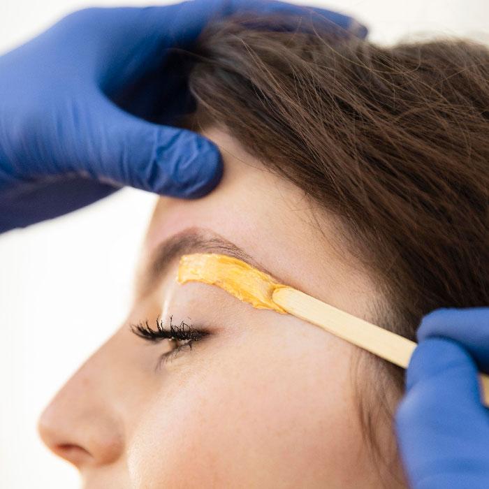 woman-getting-eyebrow-treatment